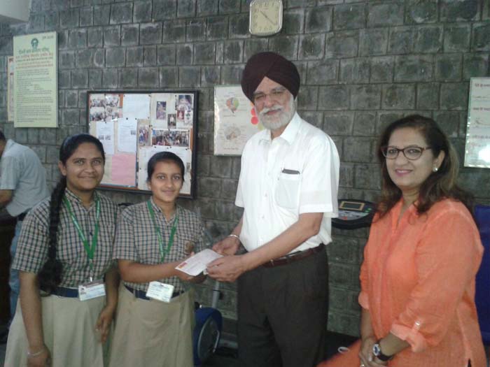 Citizenship Programme hands over proceeds of shramdaan for a free surgery at Delhi Council for Child Welfare's orthopaedic centre.